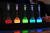  스웨덴 왕립과학원에서 지난 10월4일 2023년 노벨화학상 수상자를 발표하면서 색이 든 실험용 플라스크를 이용해 양자점이 색을 발현하는 원리를 설명하고 있다. [AFP=연합뉴스] 