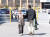 강릉 급발진 의심 사고로 피의자가 된 60대 여성 운전자 ‘도현이 할머니’(왼쪽)가 아들과 함께 경찰서에 출석하는 모습. [연합뉴스]