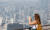 지난 9월 서울 용산구 남산타워를 찾은 관광객들이 도심을 바라보고 있다.뉴스1