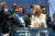하비에르 밀레이 아르헨티나 대통령(왼쪽)이 10일(현지시간) 의회에서 취임식을 한 뒤 여동생이자 비서실장인 카리나와 오픈카를 타고 대통령궁으로 카퍼레이드하고 있다. [AFP=연합뉴스]