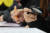 지난 13일 서울 마포구청에서 열린 '2023 마포구 노인 일자리 박람회'에서 한 참가자가 손 돋보기를 들고 구직 정보를 살펴보고 있다.   연합뉴스 
