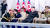 지난 9월 8일 저녁 평양 김일성광장에서 열린 정권수립 75주년 민방위무력 열병식에서 박정천 당 군정지도부장이 한쪽 무릎을 꿇고 김주애와 귓속말을 나누고 있다. 연합