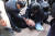 이재명 더불어민주당 대표가 지난 2일 부산 가덕도 대항전망대에서 60대 괴한에게 습격을 당한 뒤 쓰러져 있다. 사진 부산일보