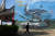 지난 14일 대만과 인접한 중국 푸젠성 핑탄섬에서 한 시민이 '중국몽 강군몽'이란 구호, 항공모함과 전차가 그려진 벽화 앞을 걸어가고 있다. AFP=연합뉴스