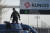 29일(현지시간) 렁지스 국제시장 입구에 배치된 군용 차량 위에 헌병이 서 있다. AP=연합뉴스