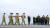 친이란 반군 공격으로 숨진 미군의 관이 바이든 대통령(가운데)이 조의를 표하는 가운데 지난 2일 미 델라웨어주 도버 공군기지에 도착하고 있다. [AP=연합뉴스]