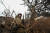 21일 우크라이나 자포리지아 지역 최전선 마을의 참호 속에 자리한 우크라니아 군인의 모습. [로이터=연합뉴스]