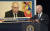 푸틴 러시아 대통령의 사진을 배경으로 발언하는 조 바이든 미국 대통령. EPA=연합뉴스