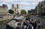 지난 2018년 5월 10일 관광객들이 파리의 헌책 가게 앞을 지나고 있다. AP=연합뉴스