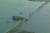 26일(현지시간) 오전 프랜시스 키 스콧 브리지의 철골이 충돌한 화물선 위로 늘어져 있다. 로이터=연합뉴스