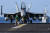 지난 1월 필리핀해 인근에서 열린 미일 합동 훈련에 참가한 미 해군 항공모함 칼빈슨함에 F/A-18 호넷 전투기가 출격을 준비하고 있다. AFP=연합뉴스