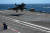 지난달 25일 프랑스 남부 툴롱 인근 해역에서 프랑스 해군 항공모함 샤를 드골함 갑판에 라팔 전투기가 착륙하고 있다. AFP=연합뉴스