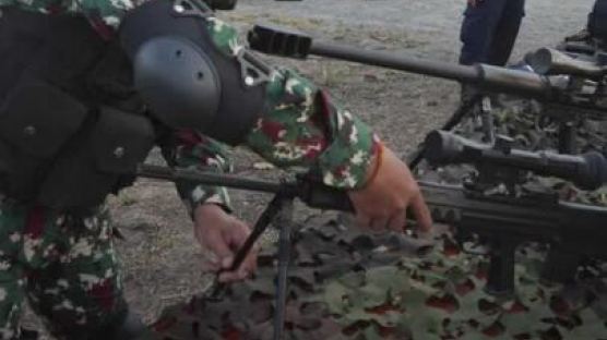 中, 캄보디아 합동훈련서 원격제어 자동소총 장착 ‘로봇개’ 공개