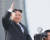 김정은 북한 노동당 위원장이 15일 평양 김일성광장에서 열린 열병식에 참석해 환호하는 군중을 향해 손을 흔들고 있다. [AP=뉴시스]