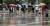 전국적으로 장맛비가 내린 12일 부산 해운대구 벡스코에서 시민들이 우산을 쓴 채 광장을 지나고 있다. 송봉근 기자