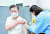 문재인 대통령이 30일 아스트라제네카 코로나 백신 2차 접종을 하고 있다. [청와대사진기자단]