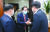 홍준표 의원이 29일 국회에서 국민의힘 사무처 직원들과 인사를 나누고 있다. [국회사진기자단]
