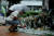 지난 23일 서울 신림역 인근 골목에 마련된 흉기난동 사건 피해자의 추모 공간에 한 시민이 찾아 고인의 명복을 빌고 있다. [연합뉴스]